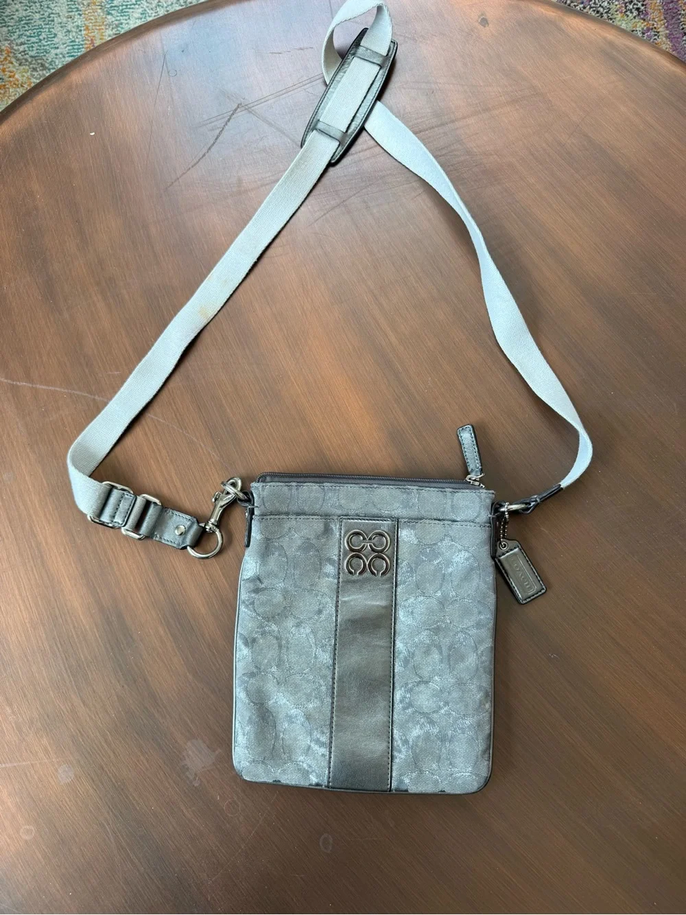 Coach crossbody bag featuring a metallic signature